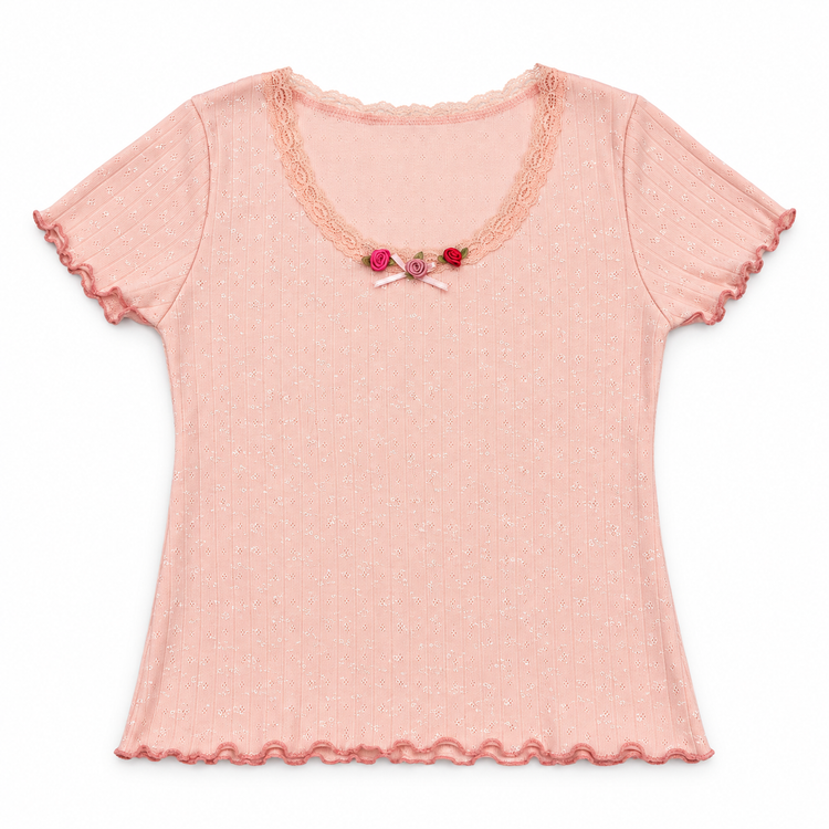 Front flat lay of the pink Rosie Dreams Two Moody Originals: Floral Daydream Top – Local Stock with scalloped lace and pink and red rose appliqués and a bow.