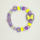 Two Moody Originals: Kandi Bracelet in Bow in Bloom – Charm Kandi