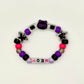 Another view of the Two Moody Originals: Kandi Bracelet in Moonlit Meow, with the cat charm rightside up
