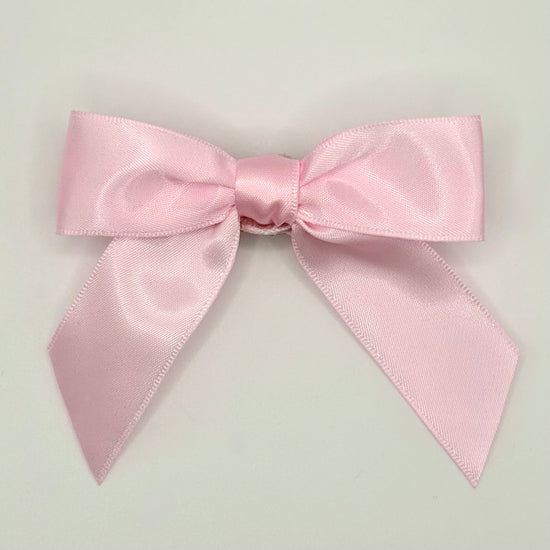Front of the large classic Two Moody Originals: Signature Bow Clips in the color light pink