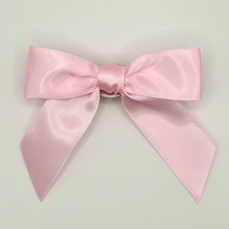 Front of the large classic Two Moody Originals: Signature Bow Clips in the color light pink