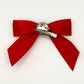 Back of the large decorated Two Moody Originals: Signature Bow Clips in the color red, showcasing the alligator hair clip and brooch pin