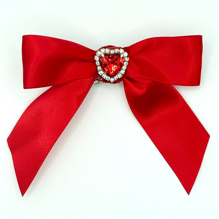 Front of the large decorated Two Moody Originals: Signature Bow Clips in the color red with a heart rhinestone center
