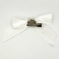 Back of the large decorated Two Moody Originals: Signature Bow Clips in the color white, showcasing the alligator hair clip and brooch pin
