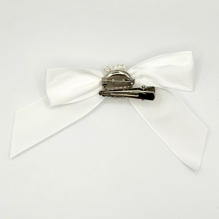 Back of the large decorated Two Moody Originals: Signature Bow Clips in the color white, showcasing the alligator hair clip and brooch pin