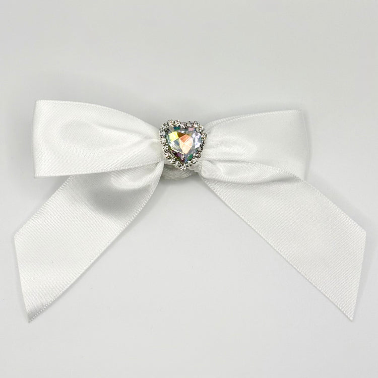 Front of the large decorated Two Moody Originals: Signature Bow Clips in the color white with a heart rhinestone center
