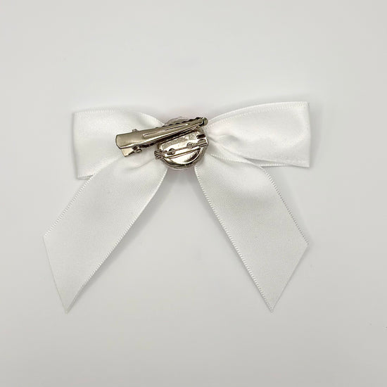 Back of the large decorated Two Moody Originals: Signature Bow Clips in the color white with hot pink rose, showcasing the alligator hair clip and brooch pin
