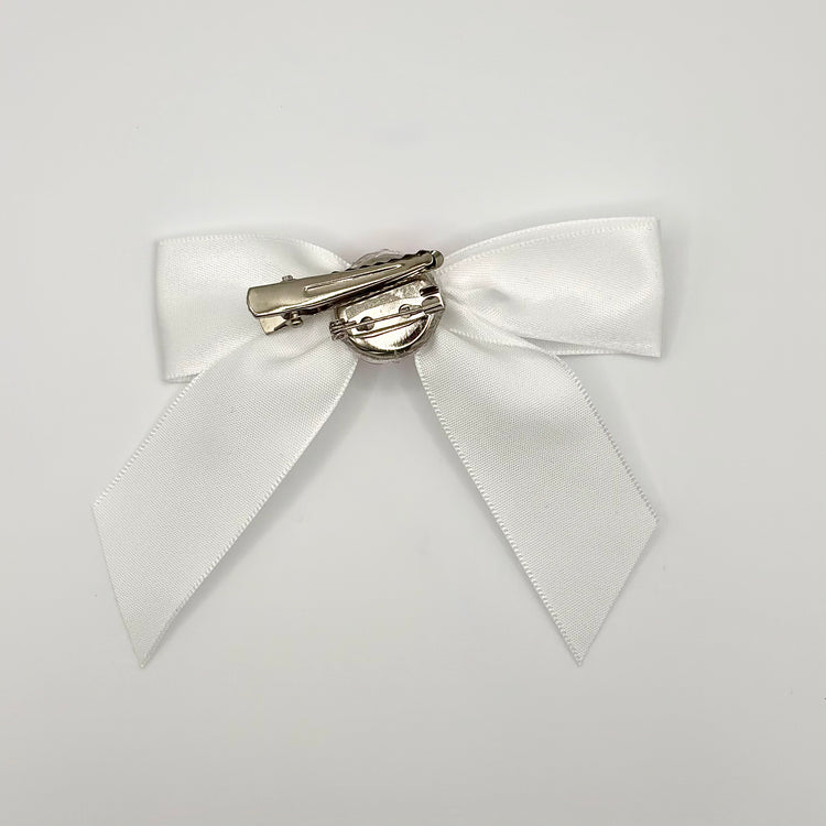 Back of the large decorated Two Moody Originals: Signature Bow Clips in the color white with hot pink rose, showcasing the alligator hair clip and brooch pin
