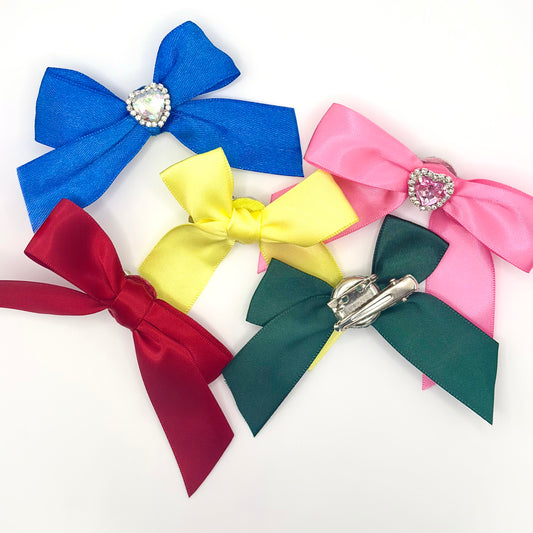 Two Moody Originals: Signature Bow Clips in assorted colors, showing the front and back of the bow clips