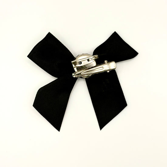 Back of the small classic Two Moody Originals: Signature Bow Clips in the color black, showcasing the alligator hair clip and brooch pin