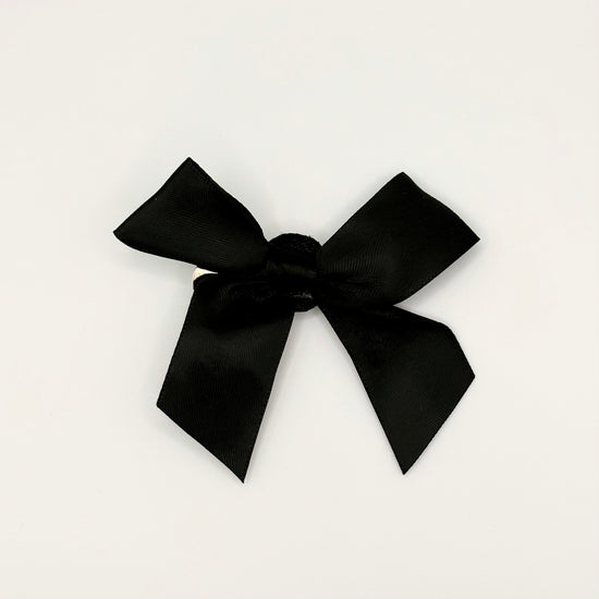 Front of the small classic Two Moody Originals: Signature Bow Clips in the color black