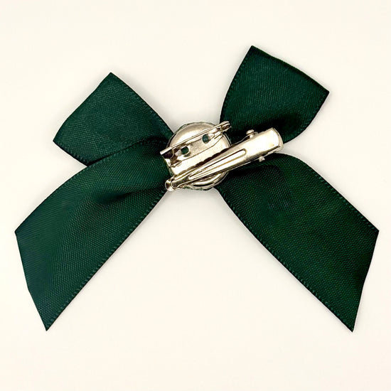 Back of the small classic Two Moody Originals: Signature Bow Clips in the color dark green, showcasing the alligator hair clip and brooch pin