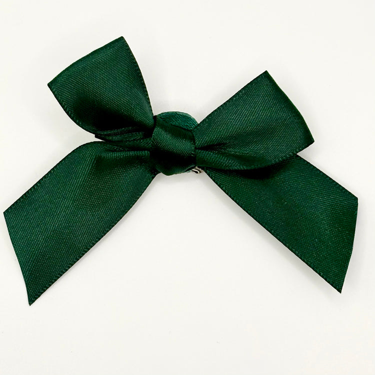 Front of the small classic Two Moody Originals: Signature Bow Clips in the color dark green