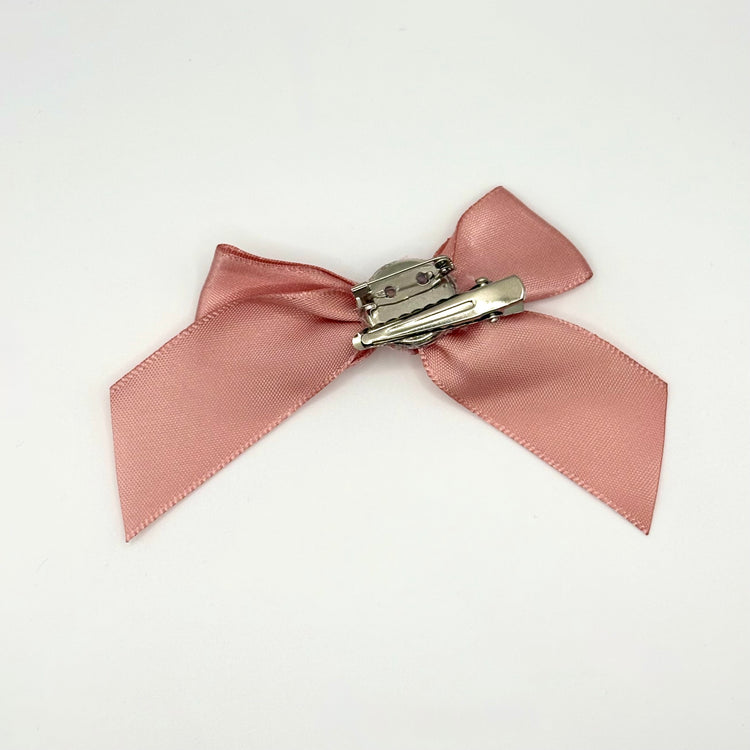 Back of the small classic Two Moody Originals: Signature Bow Clips in the color dusty rose, showcasing the alligator hair clip and brooch pin