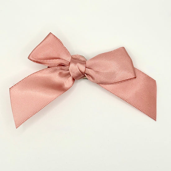 Front of the small classic Two Moody Originals: Signature Bow Clips in the color dusty rose