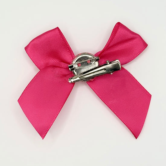 Back of the small classic Two Moody Originals: Signature Bow Clips in the color hot pink, showcasing the alligator hair clip and brooch pin