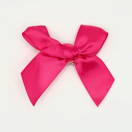 Front of the small classic Two Moody Originals: Signature Bow Clips in the color hot pink
