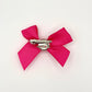 Back of the small decorated Two Moody Originals: Signature Bow Clips in the color hot pink with light pink rose, showcasing the alligator hair clip and brooch pin