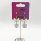 Two Moody Originals: Soft Bloom Bow Earrings displayed on branded packaging with white bow details and floral charms.