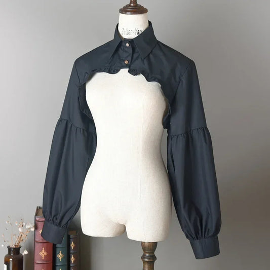 Slightly angled front view of the black Ultra Cropped Layering Blouse displayed on a mannequin.