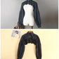 Front views of the black Ultra Cropped Layering Blouse on a mannequin and a hanger.