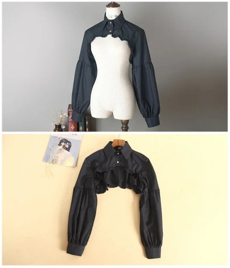 Front views of the black Ultra Cropped Layering Blouse on a mannequin and a hanger.