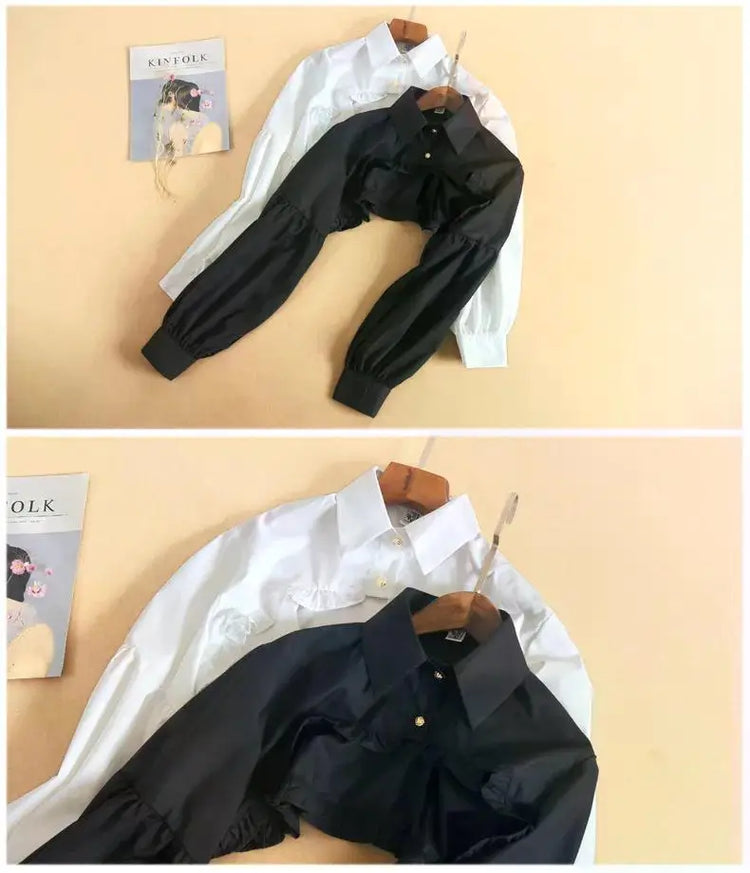 Comparison of the black and white Ultra Cropped Layering Blouse featuring structured collars, golden rose buttons, dramatic long sleeves, and ultra-cropped silhouettes.