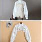 Front views of the white Ultra Cropped Layering Blouse on a mannequin and a hanger.