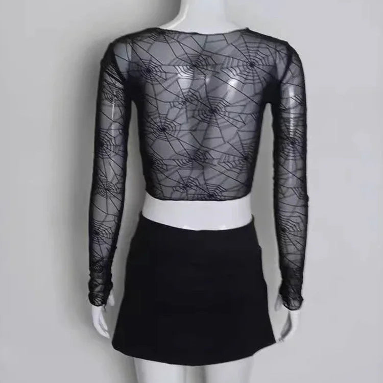 Back view of the Web of Shadows Mesh Top, featuring sheer black spiderweb mesh, full-length sleeves, and a cropped fit.