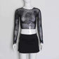 Full front view of the Web of Shadows Mesh Top, displayed on a mannequin, highlighting the sheer spiderweb mesh and cropped slim fit.