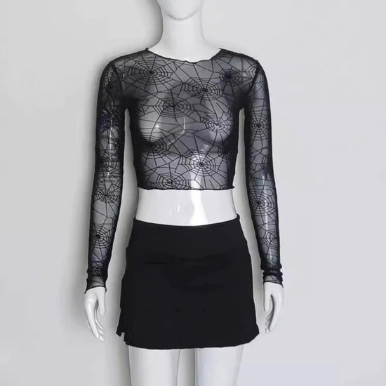 Full front view of the Web of Shadows Mesh Top, displayed on a mannequin, highlighting the sheer spiderweb mesh and cropped slim fit.