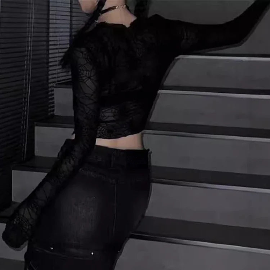 View of model wearing the Web of Shadows Mesh Top from the side, showcasing the sheer spiderweb mesh, cropped silhouette, and fitted design.