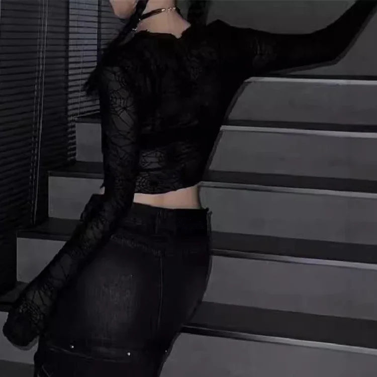 View of model wearing the Web of Shadows Mesh Top from the side, showcasing the sheer spiderweb mesh, cropped silhouette, and fitted design.