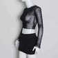 Side view of the Web of Shadows Mesh Top, displaying the sheer spiderweb mesh, slim fit, and cropped silhouette.