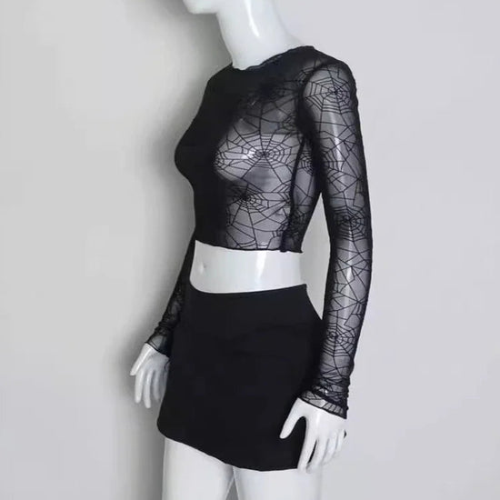 Side view of the Web of Shadows Mesh Top, displaying the sheer spiderweb mesh, slim fit, and cropped silhouette.
