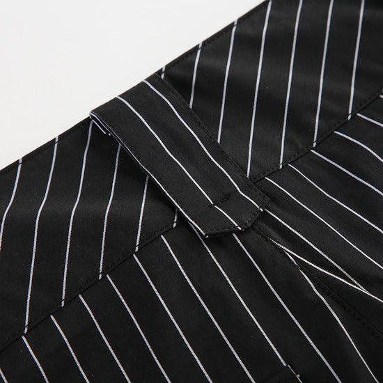 Close-up of Y2K Business Chic Trousers belt loop on black pinstriped fabric