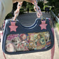 Back view of the Y2K Harajuku Star Denim Chain Bag in light blue with a large clear display pocket holding decorative cards and images.