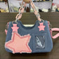 Front view of the Y2K Harajuku Star Denim Chain Bag in light blue denim with a pink star appliqué, chain handle, and clear display pocket.