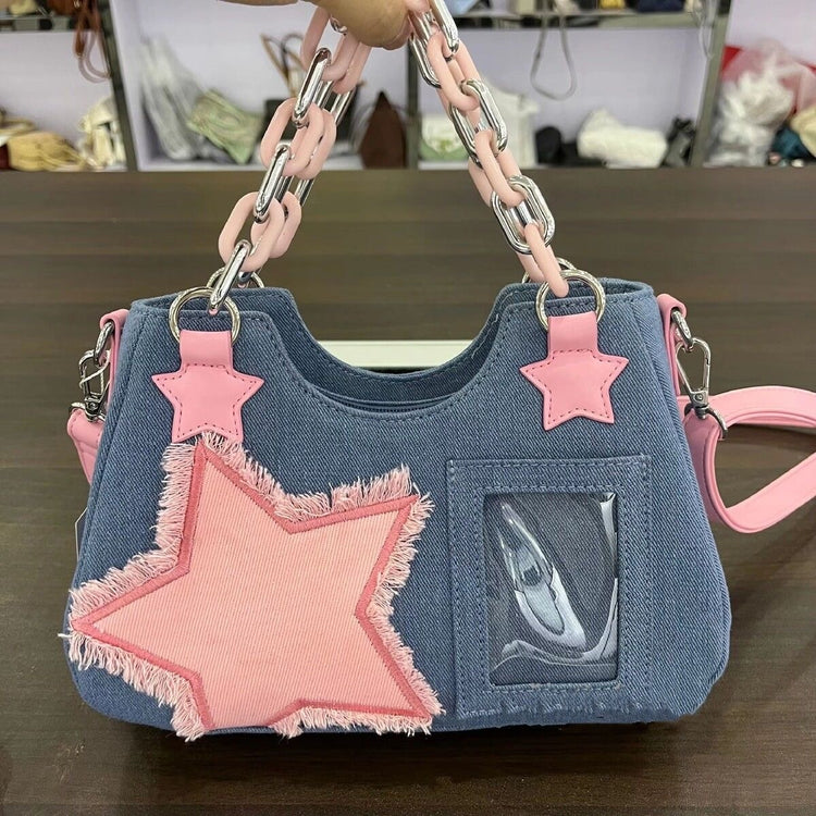 Front view of the Y2K Harajuku Star Denim Chain Bag in light blue denim with a pink star appliqué, chain handle, and clear display pocket.