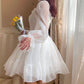 Side profile of Cloudlight Fairy Dress highlighting puff sleeves and chiffon fabric