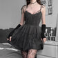 Model standing in Dark Fairy Tulle Dress with black arm warmers and fishnet tights
