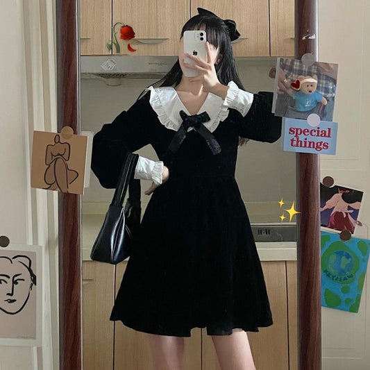 A closer view of the oversized bow and sailor-style collar detail on Midnight Sailor Mini Dress while still showing the full dress