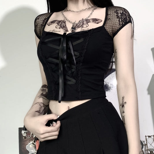 Model wearing Petal Noir Lace-Up Top, front view with lace mesh sleeves and ribbon tie