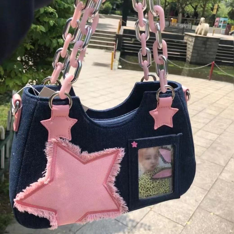Front view of the Y2K Harajuku Star Denim Chain Bag in dark blue with an oversized pink star appliqué, chain handle, and clear photo pocket.